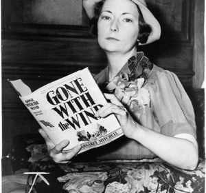 Gone With the Wind author Margaret Mitchell posing with her novel.